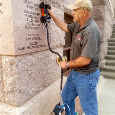 Man using the 1600 MHZ to assess the condition of concrete